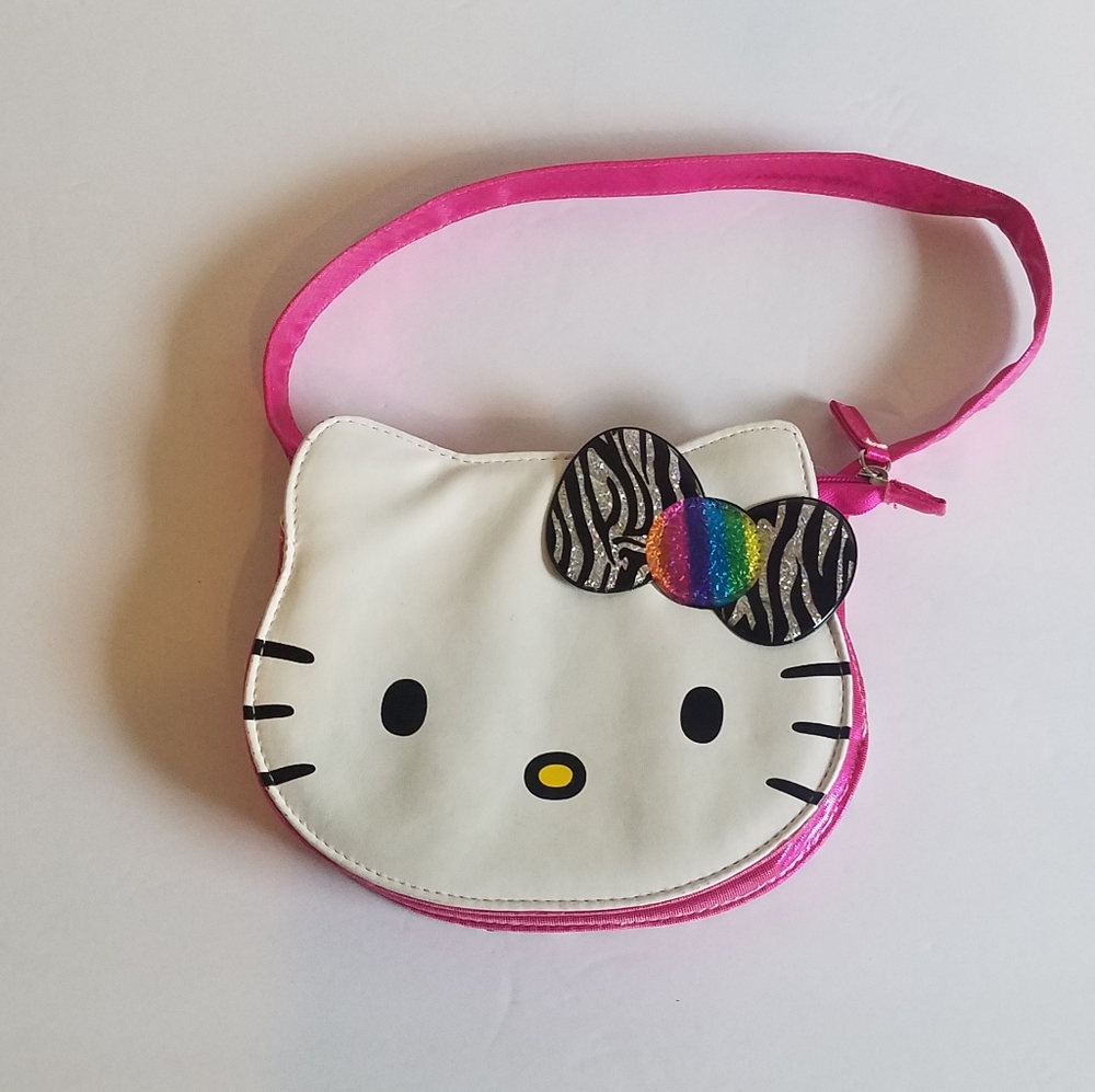 Hello Kitty purse. Rainbow bow feature. Leppard.